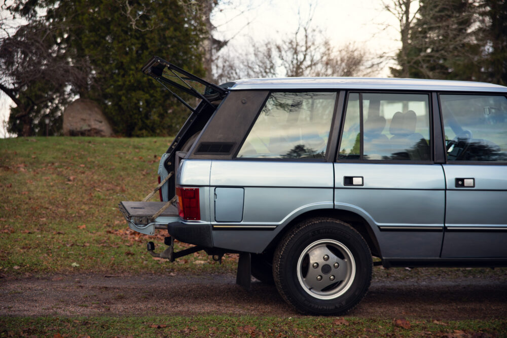 Vintage station wagon parked outdoors with open trunk