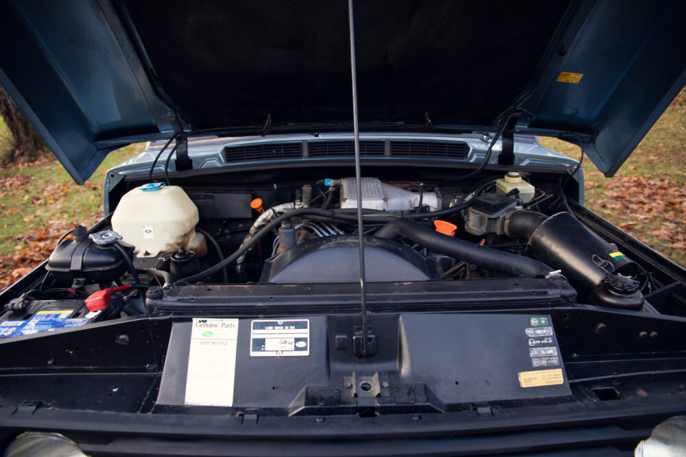 Open car hood showing detailed engine compartment