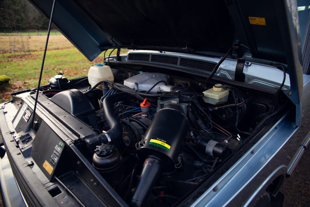 Open car hood showing detailed engine compartment