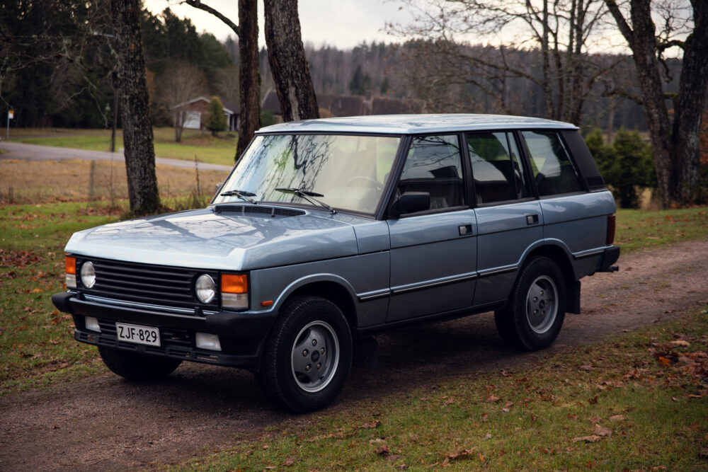 Vintage gray SUV parked outdoors in autumn setting