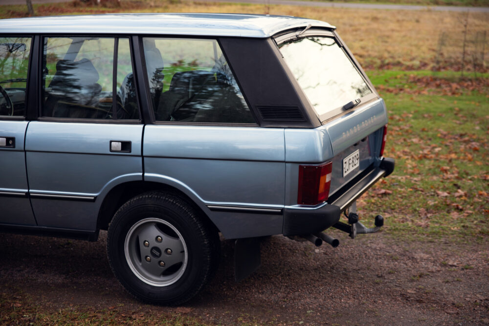 Vintage Range Rover parked outdoors on a cloudy day