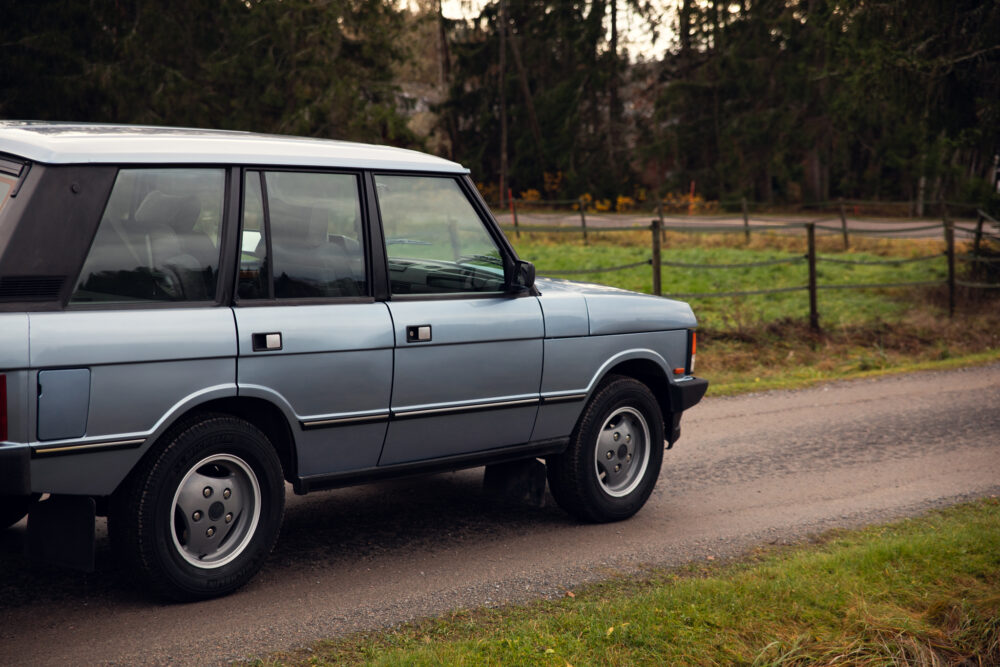 Vintage SUV parked on rural roadside