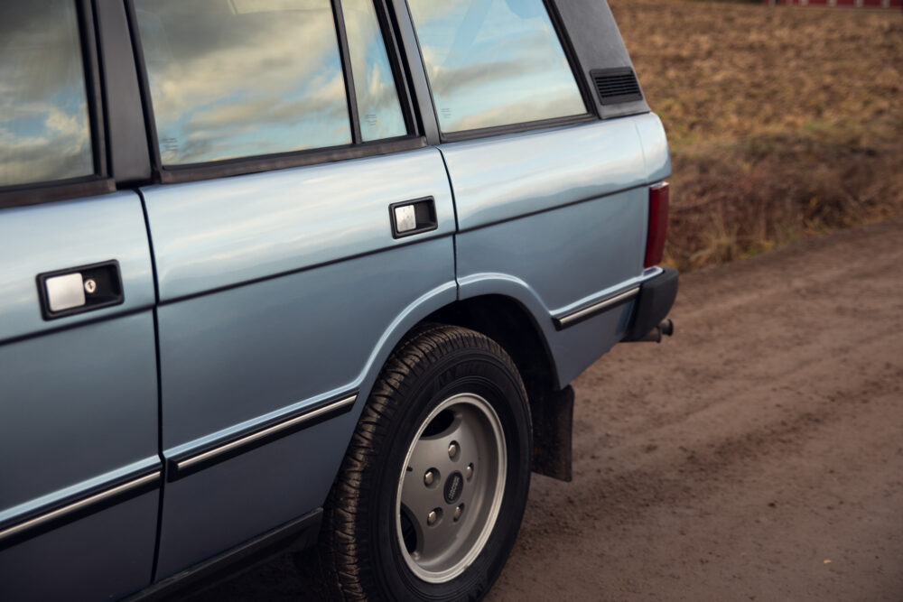 Vintage blue car parked on roadside