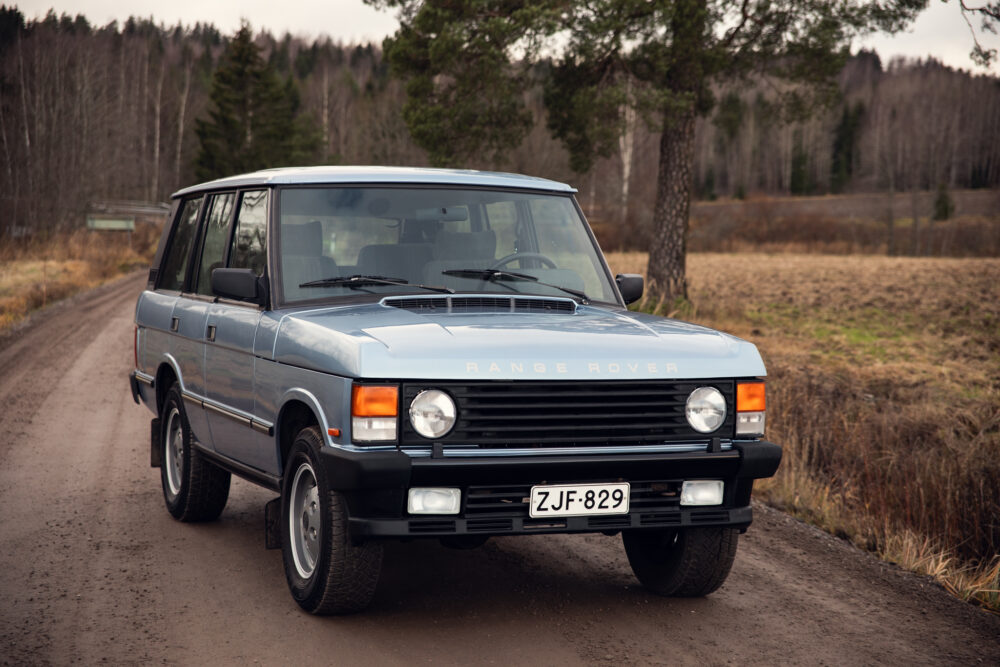 Vintage Range Rover parked on rural road