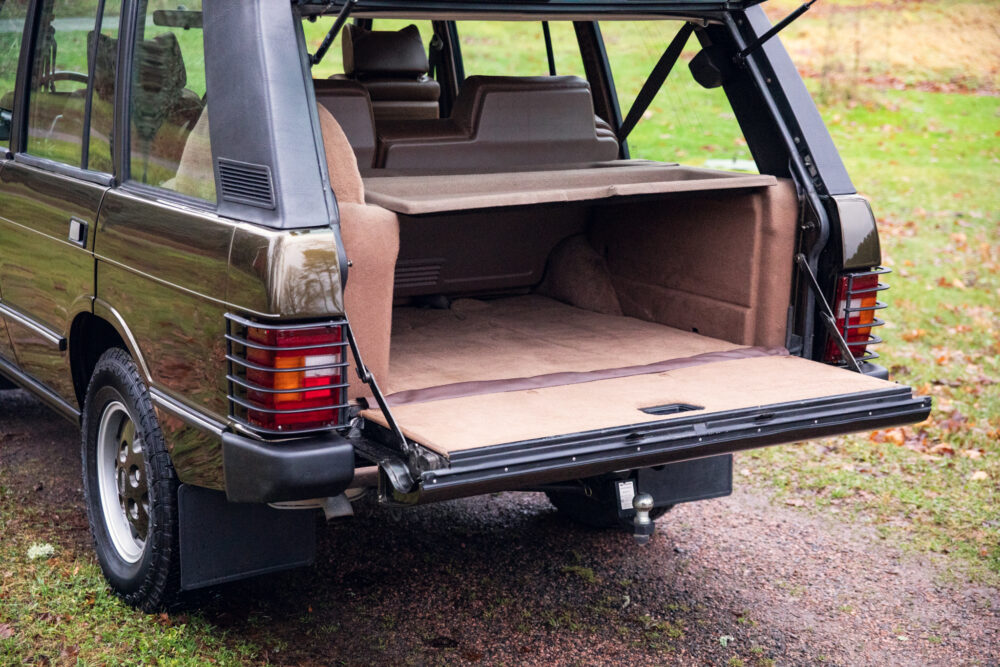 Open trunk of vintage station wagon on a cloudy day