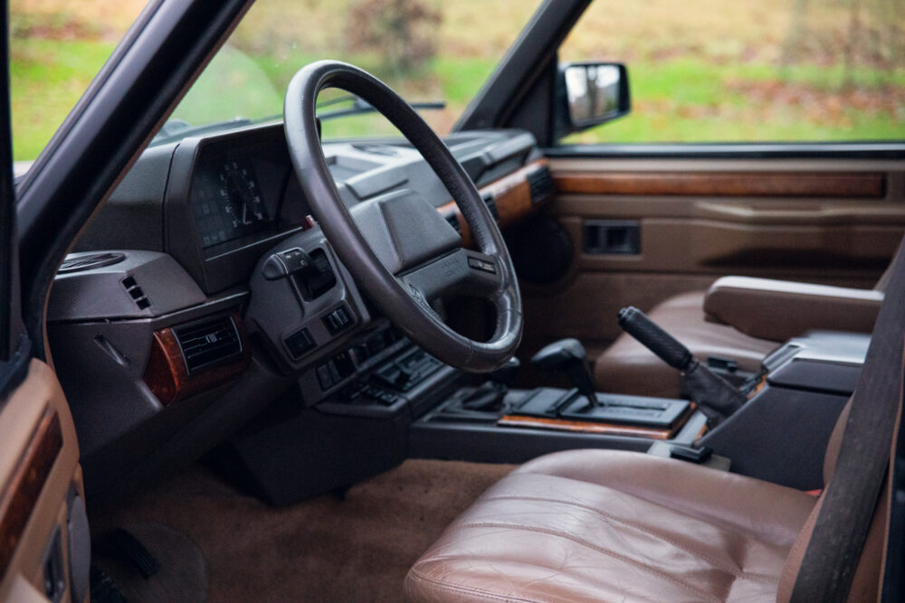 Vintage car's interior with leather seats and dashboard