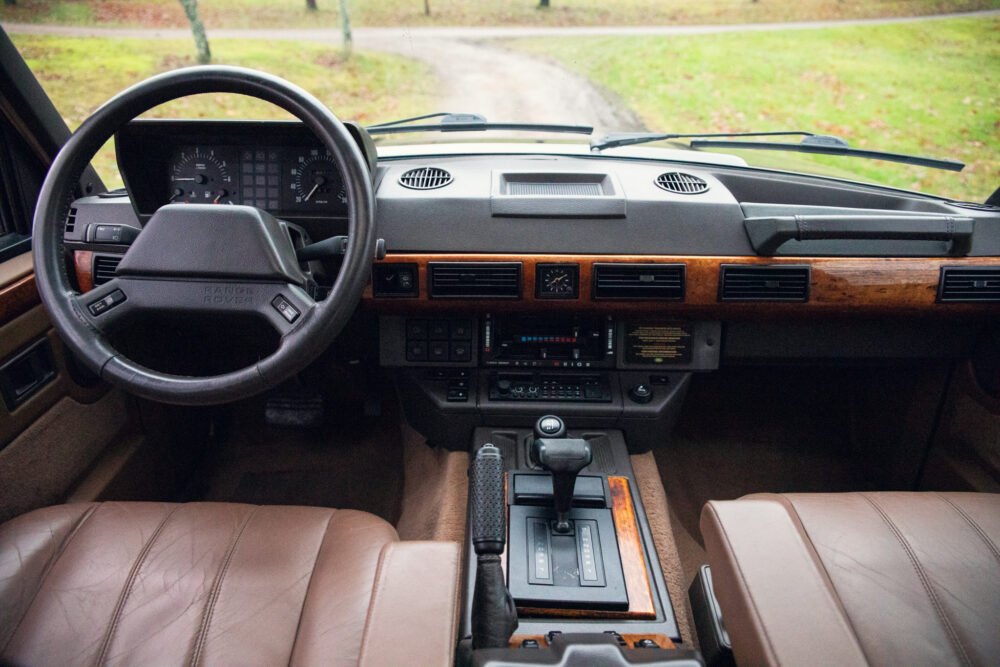 Vintage Range Rover interior with wooden dashboard