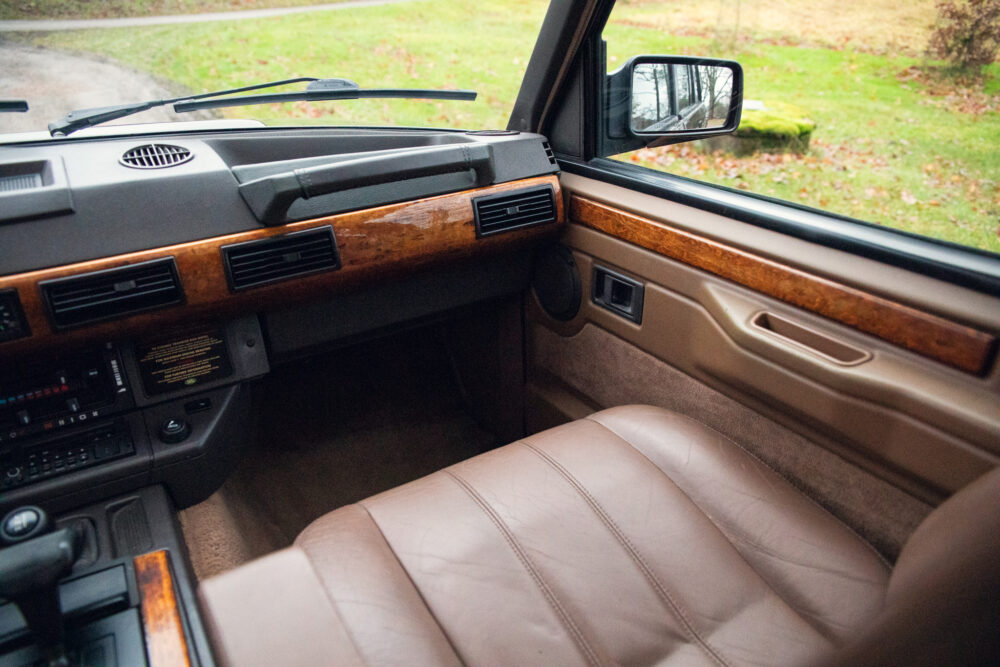 Vintage car interior with wooden panel dashboard