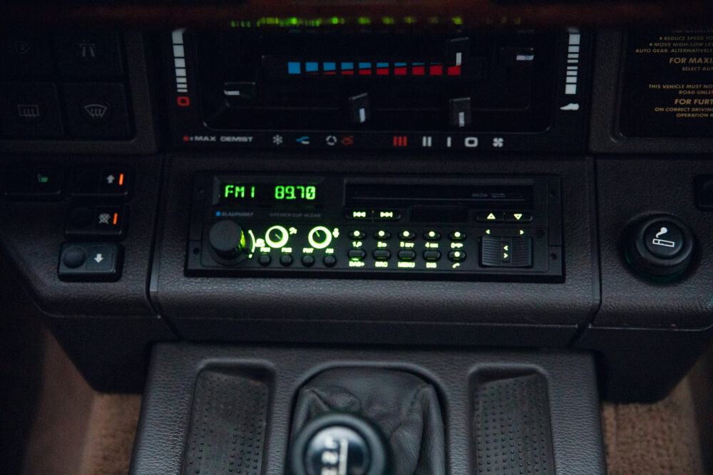 Close-up view of a car's vintage radio and dashboard