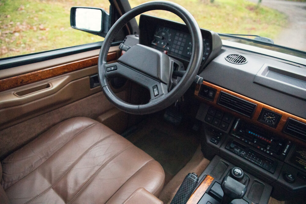 Vintage car interior with leather seats and wooden details