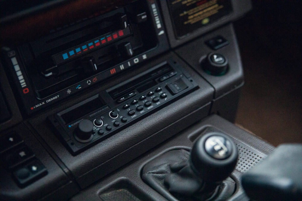 Vintage car dashboard with radio and manual gear shift