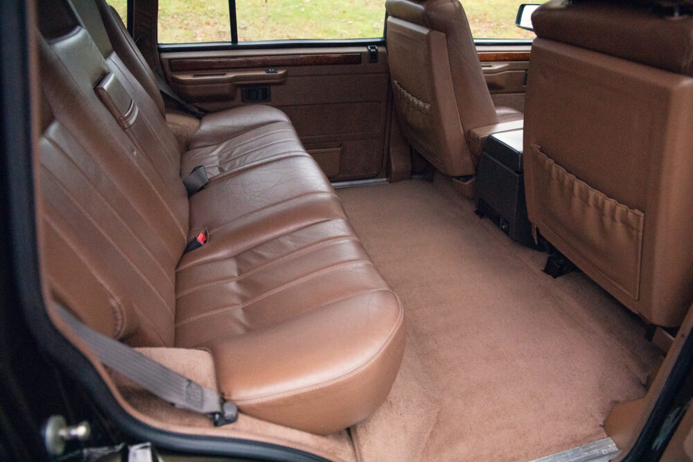 Luxurious brown leather car interior with spacious seating
