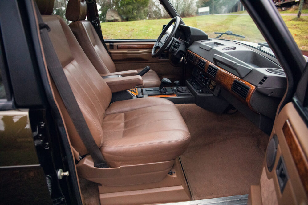 Vintage car interior with brown leather seats and dashboard