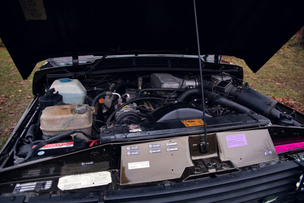 Open car hood showing detailed engine compartment