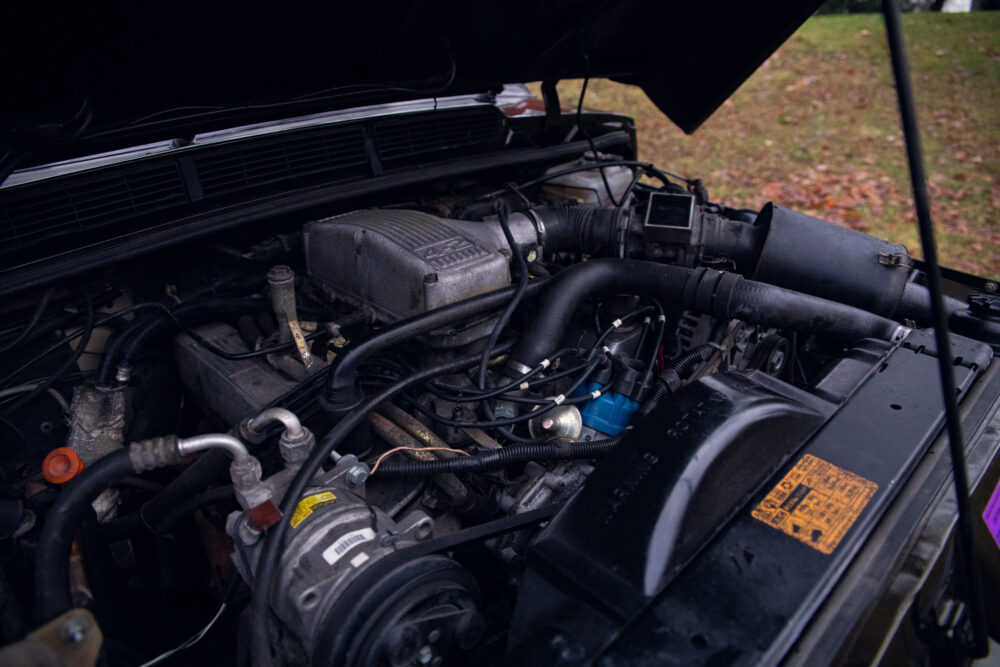Detailed view of an open car engine compartment