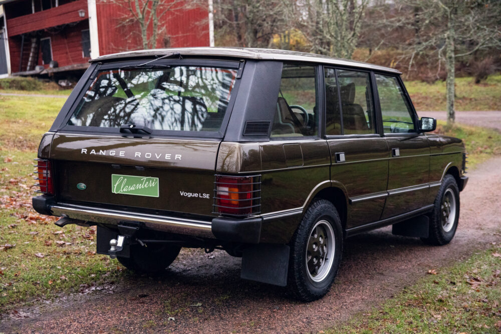 Vintage dark green Range Rover parked outdoors