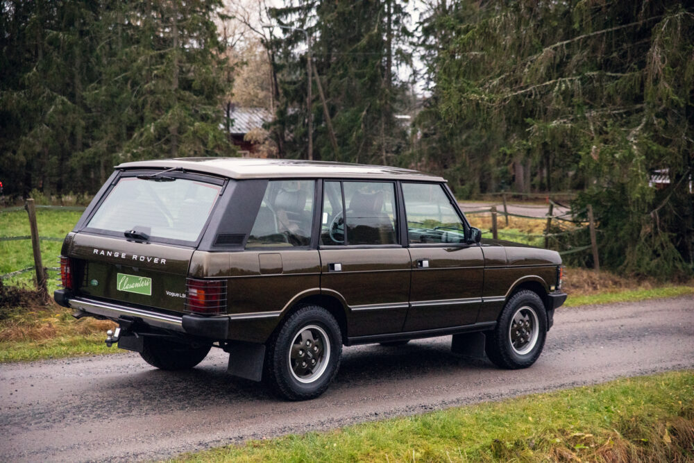 Classic Range Rover parked on rural road