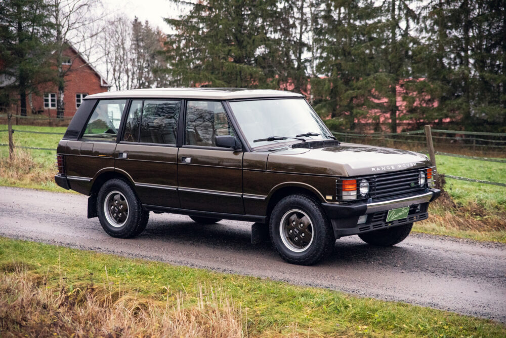 Vintage brown Range Rover on a rural road