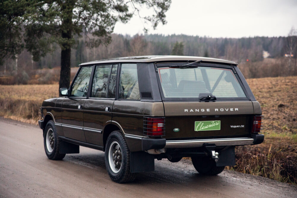 Vintage Range Rover parked on rural road