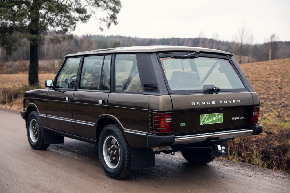 Vintage Range Rover parked on rural road