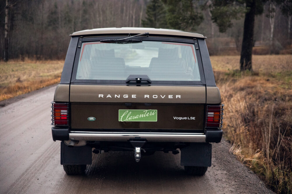 Vintage Range Rover on forest road