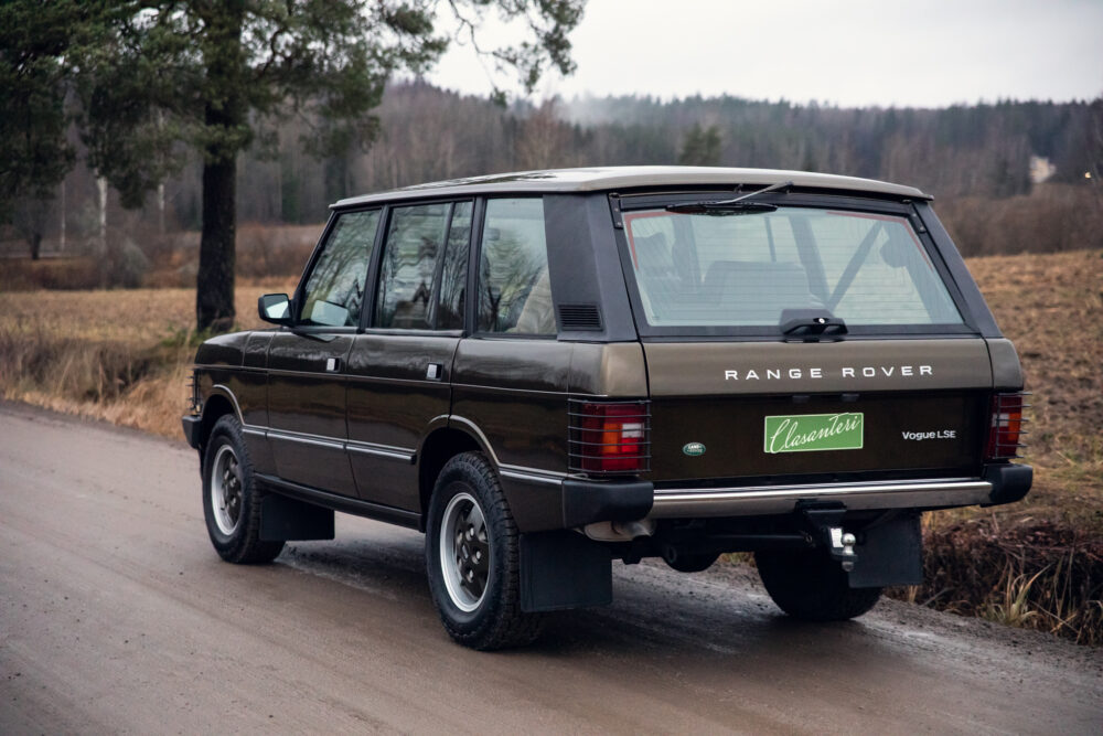 Vintage Range Rover parked on a rural road