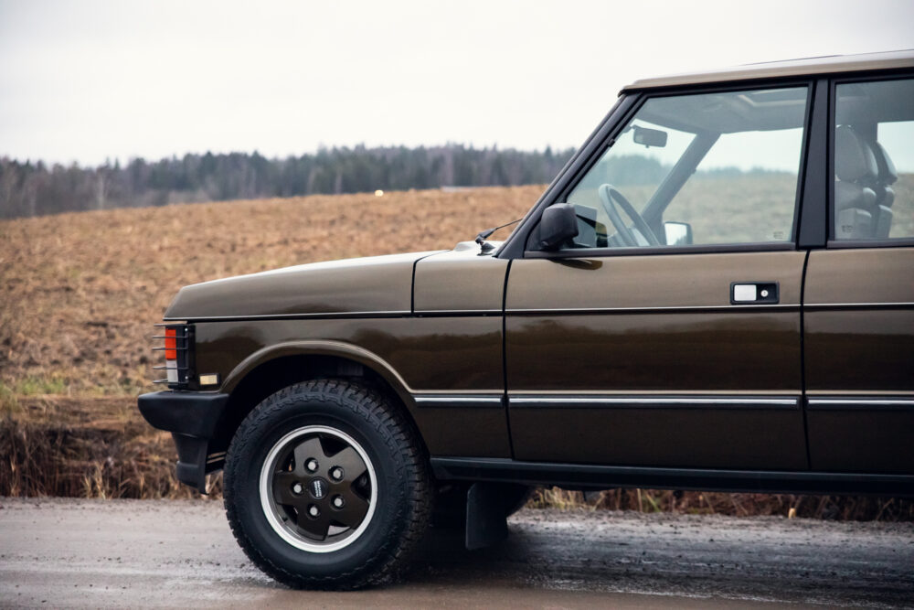 Vintage brown SUV on a rural road