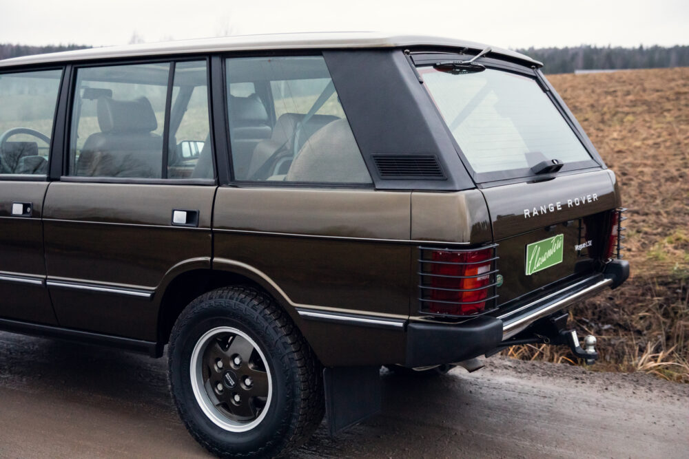 Vintage Range Rover parked on country road