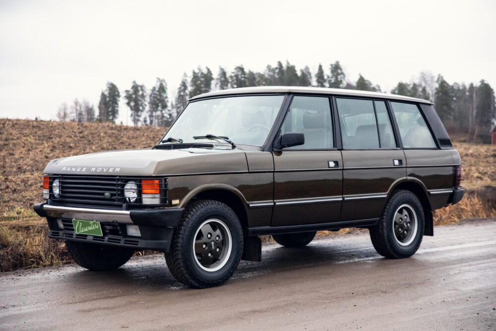 Vintage Range Rover parked on a country road