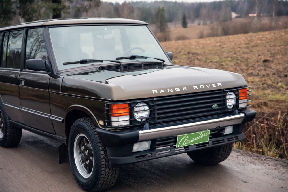 Vintage Range Rover parked on rural road