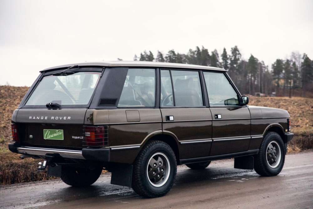 Vintage Range Rover parked on rural road