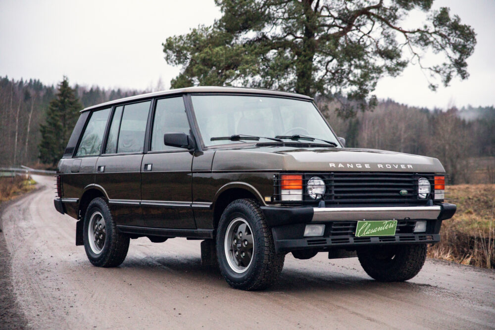 Vintage Range Rover on a forest road