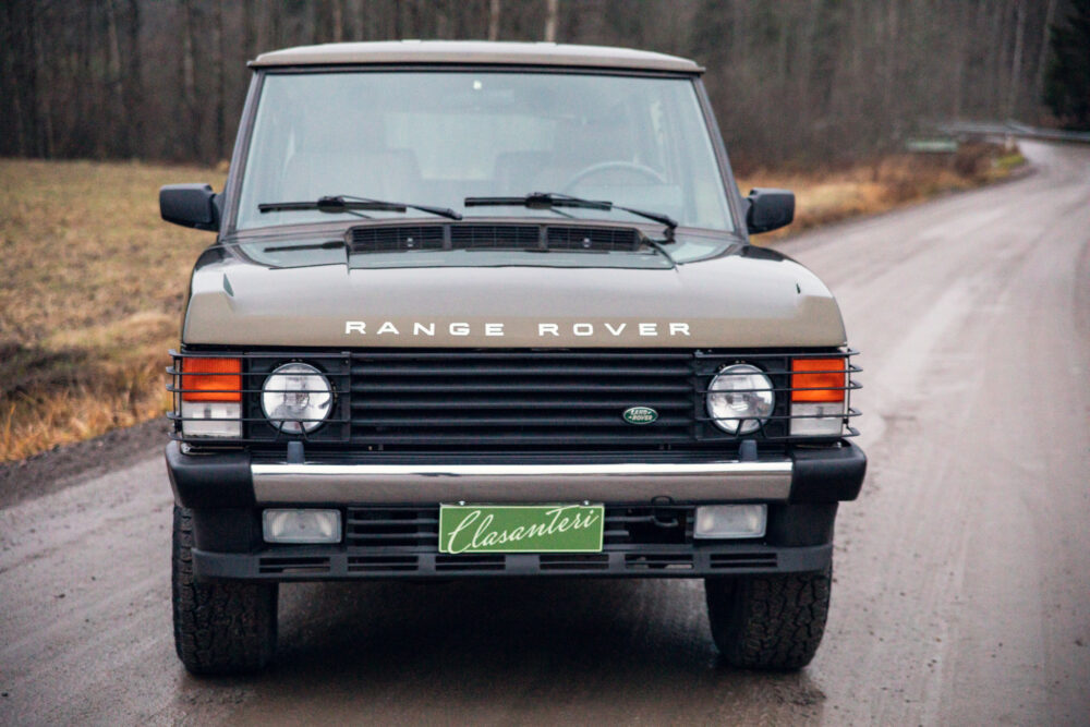 Vintage Range Rover on forest road