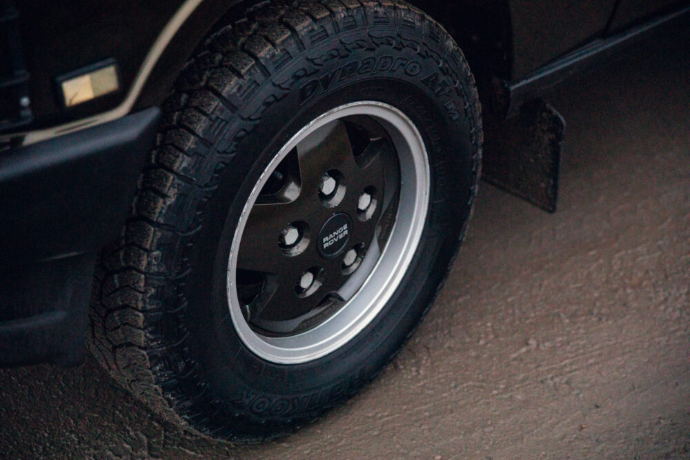 Black Range Rover wheel with rugged tire