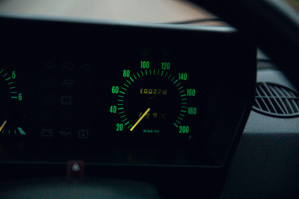 Car dashboard showing speedometer at 91 km/h