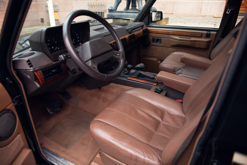 Vintage car interior with brown leather seats