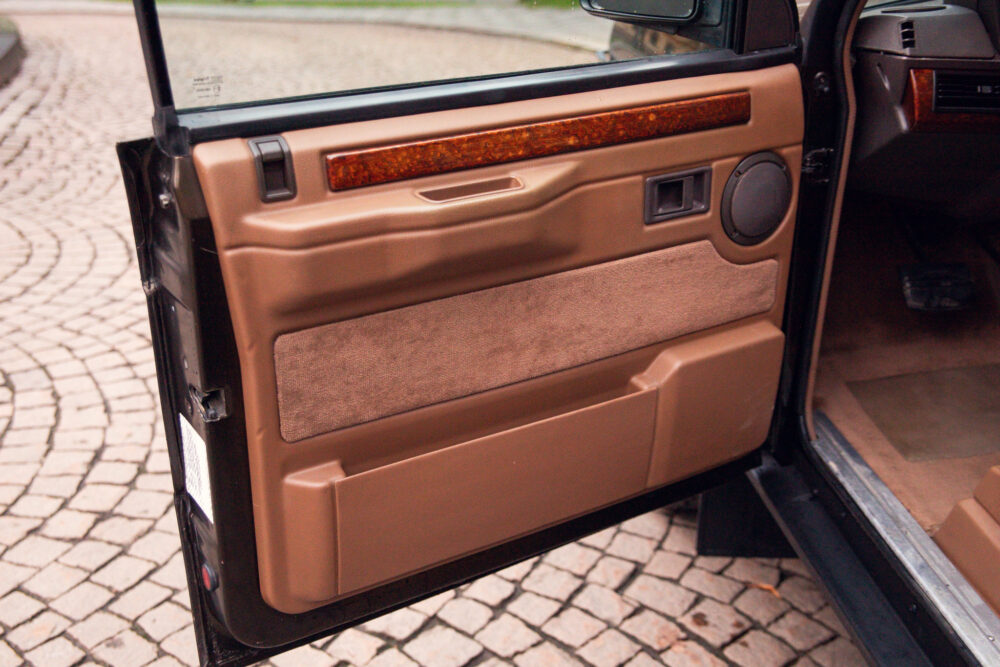 Open car door with detailed brown interior design