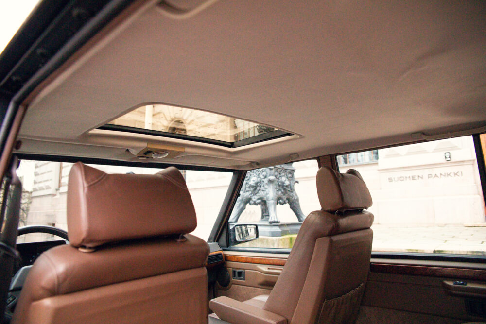 Luxury car interior with view of historical statue outside