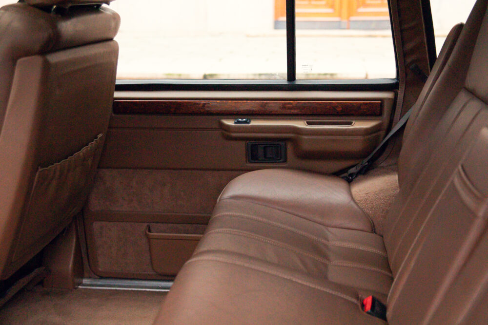 Luxury car interior with leather seats and wood trim