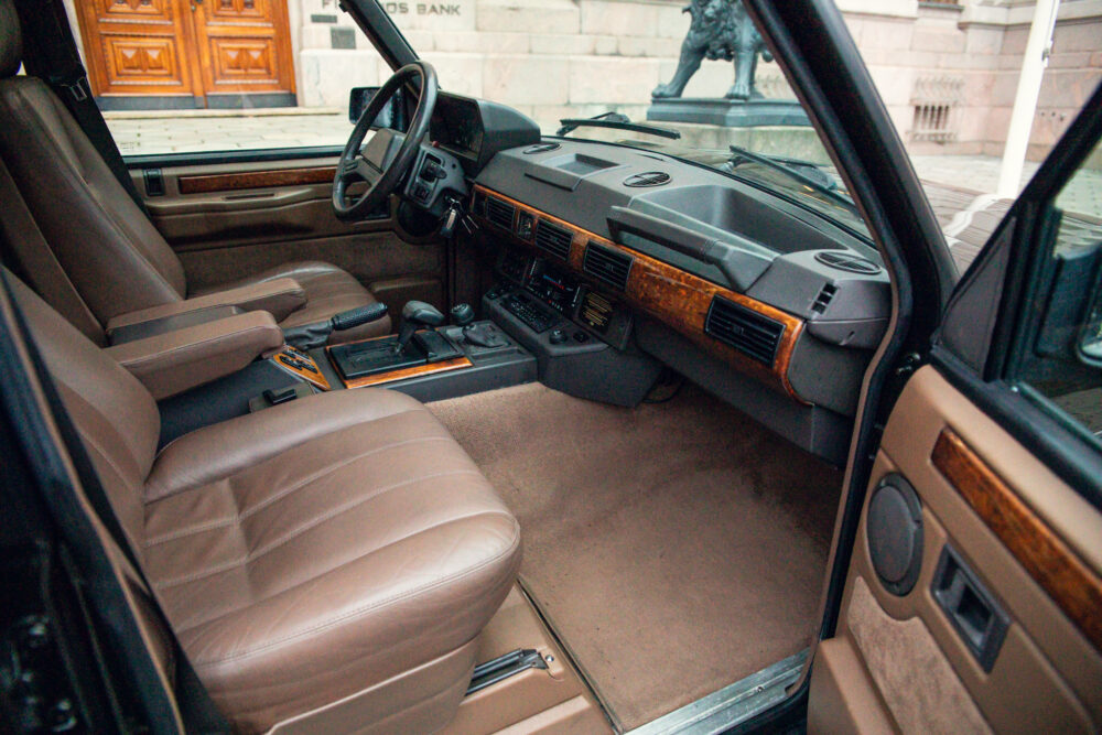Vintage car interior with brown leather seats and dashboard