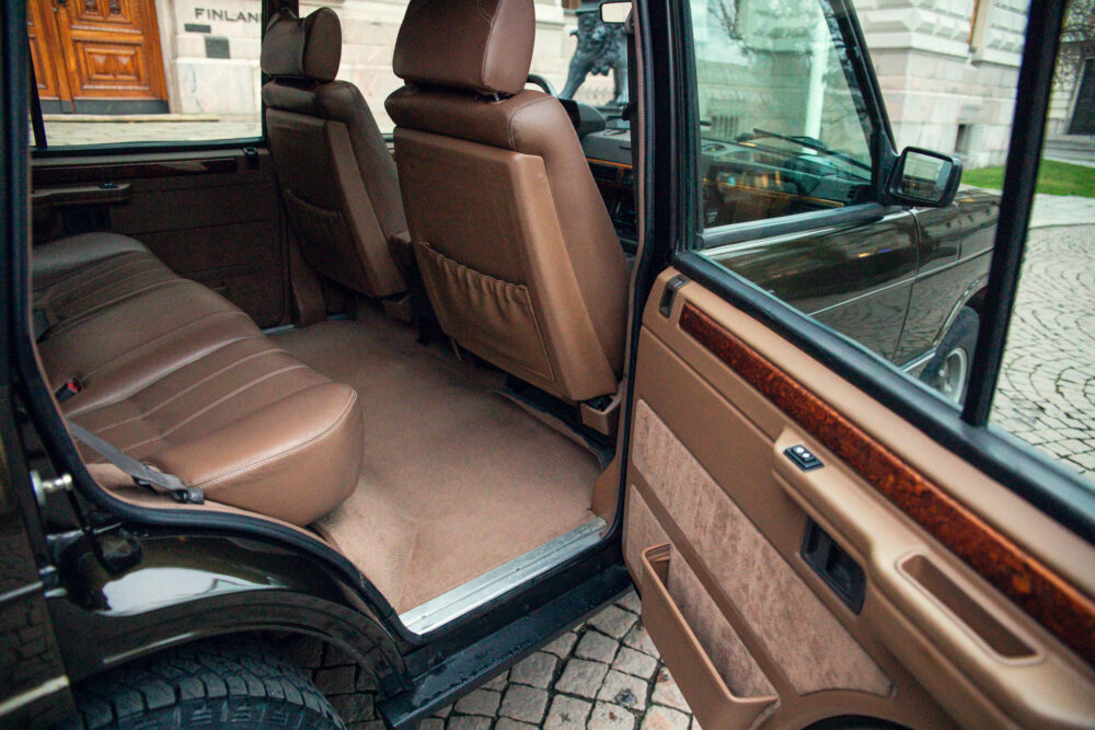 Open SUV door showing luxurious interior and seats