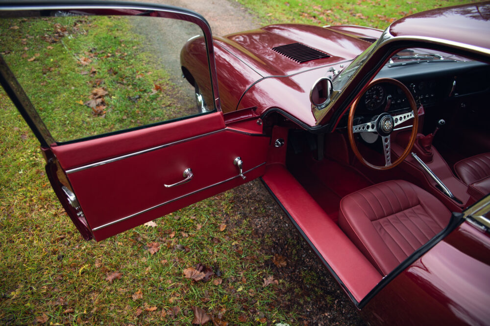 Vintage red car interior and open door detail