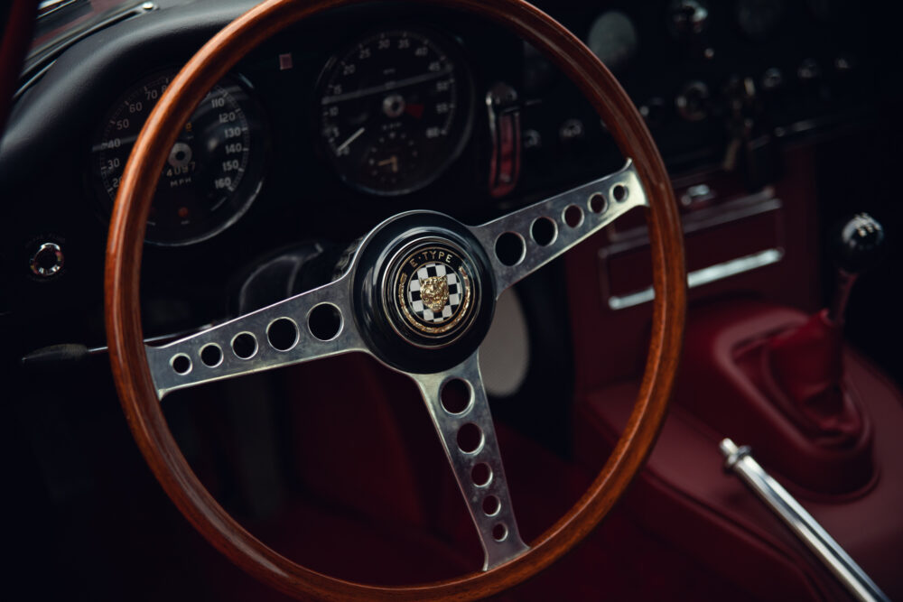 Vintage car wooden steering wheel and dashboard