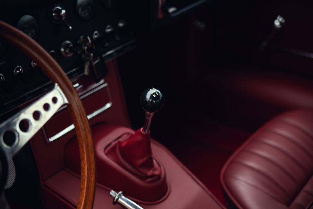 Vintage car interior with wooden steering wheel