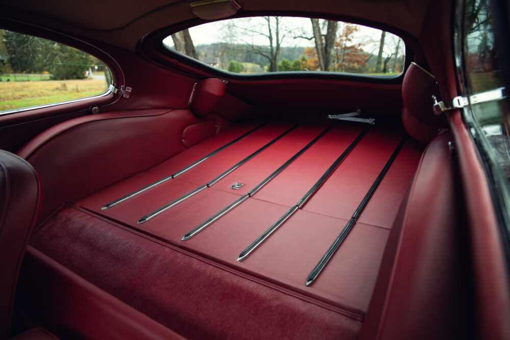 Vintage car interior with red leather seats and trim