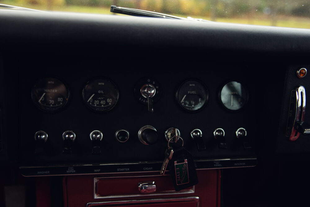 Vintage car dashboard with gauges and ignition key