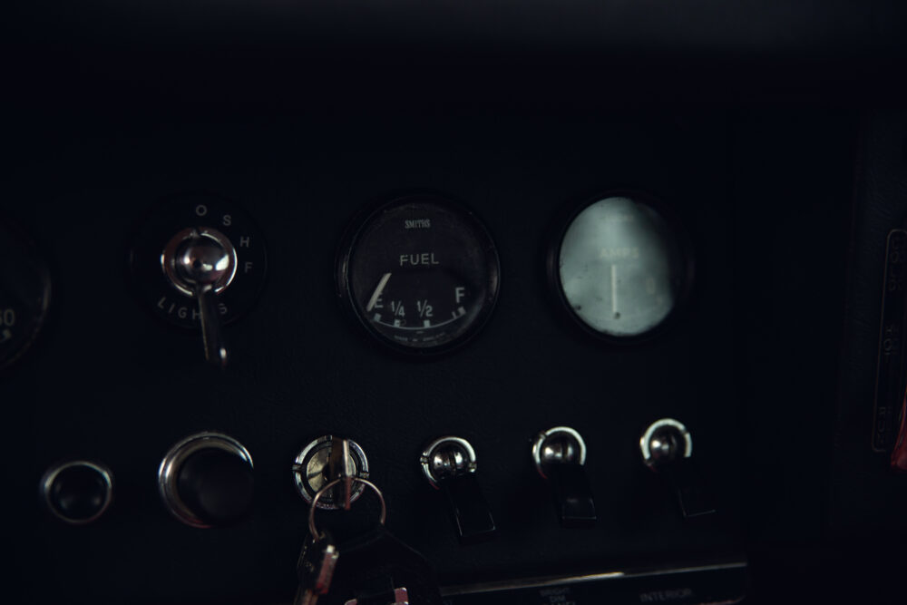 Vintage car dashboard with fuel gauge and switches