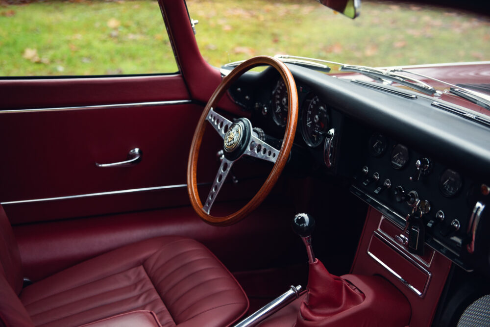Vintage car interior with wooden steering wheel