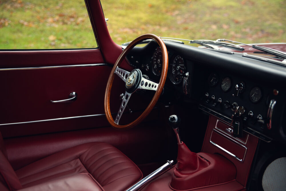 Vintage car interior with wooden steering wheel
