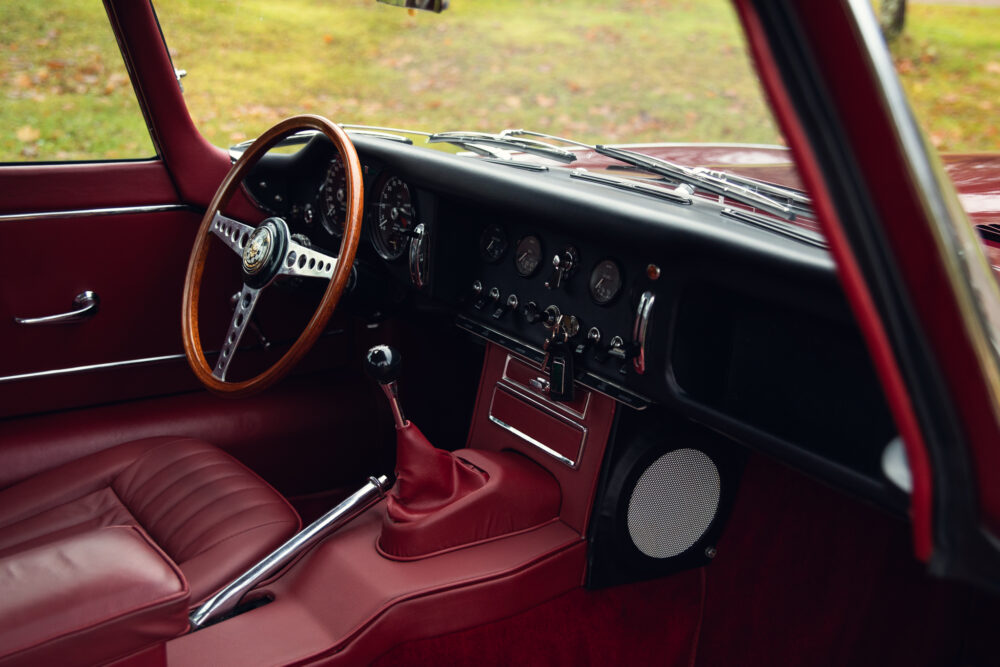 Vintage car interior with red leather seats and dashboard